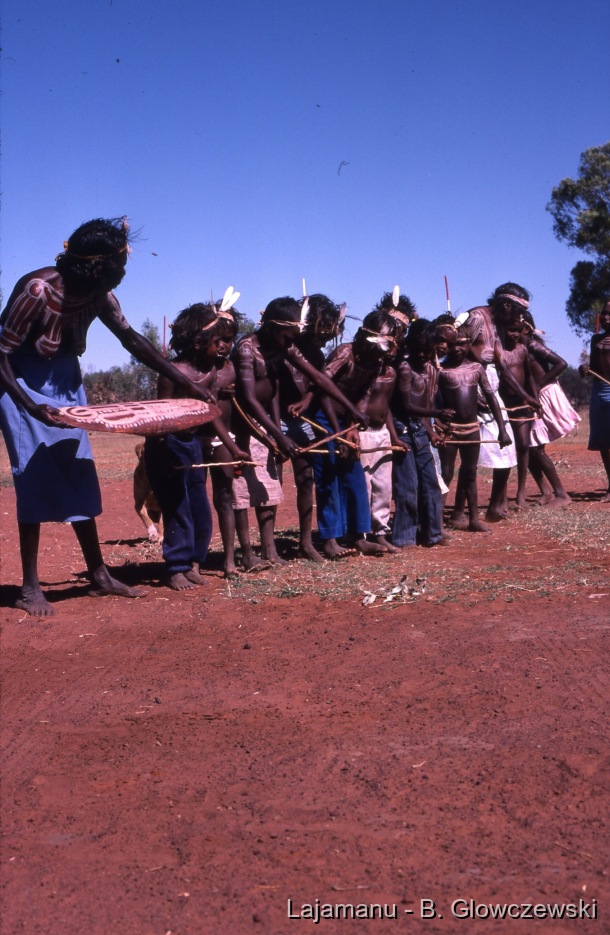 School 2 / Girls dance with kuturu (sticks) and a parraja (dish) painted. They wear feather headbands. / Barbara Glowczewski / School, Lajamanu, Tanami Desert, Central Australia