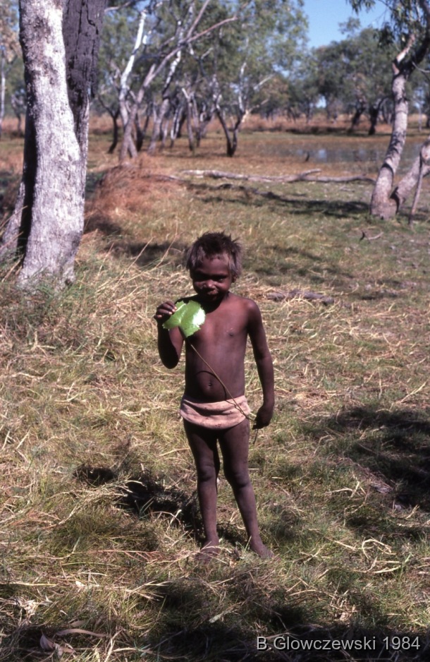 Hunting, Lajamanu 1984 (2) / Boy eating; Training to film / Barbara Glowczewski / 28 miles (from Lajamanu), Tanami Desert, Central Australia