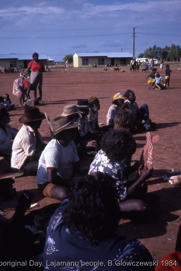 NAIDOC: National Aboriginal Day, Lajamanu and Katherine, 1984 (photos) / Men watch boys dancing. Children and adults celebrate the end of School / Barbara Glowczewski / Lajamanu, Tanami Desert, Central Australia, NT