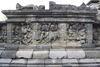 Borobudur > Galerie I > Balustrade supérieure : Histoire du laboureur qui trouve un lingot d'or (?)