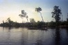 Cannibal Tours_Neg_Children in canoes