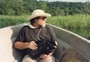 Diverse filmings_Prints_Chris on boat with video camera