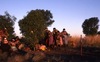 YAWAKIYI (Bush plum) dance in front of a kuturu (stick)  erected in the ground; Making a video to protect Yarturluyarturlu