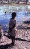 Girl in front of waterhole; Training to film