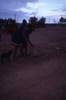 Women dance Jurntu purlapa. A parraja (dish) painted is erected in the ground. Children and adults celebrate the end of School