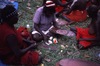 Women paint parraja (dish) for Jurntu purlapa. Public performance for NAIDOC