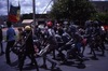 People marching and dancing for NAIDOC