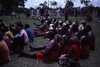 Lajamanu women watch Lajamanu men dancing Jurntu purlapa. Public performance for NAIDOC