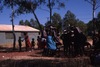 Women and kids dance in the park