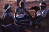 Women dance NGARRKA (Initiated man) with yukurrukurru (slates)