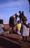 end of mourning ritual with the kuturru stick put away by Topsy Nangala. Judy Napangardi holds a baby.