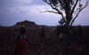 Women performing a ritual cleansing on Napaljarri/Nungarrayi land, near the jilimi hill