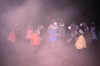 Women dance NGURLU (Seed) at night time, with feather headband and painted dishes, 
