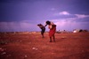 Women dance PILJA (Goanna) with feather headband